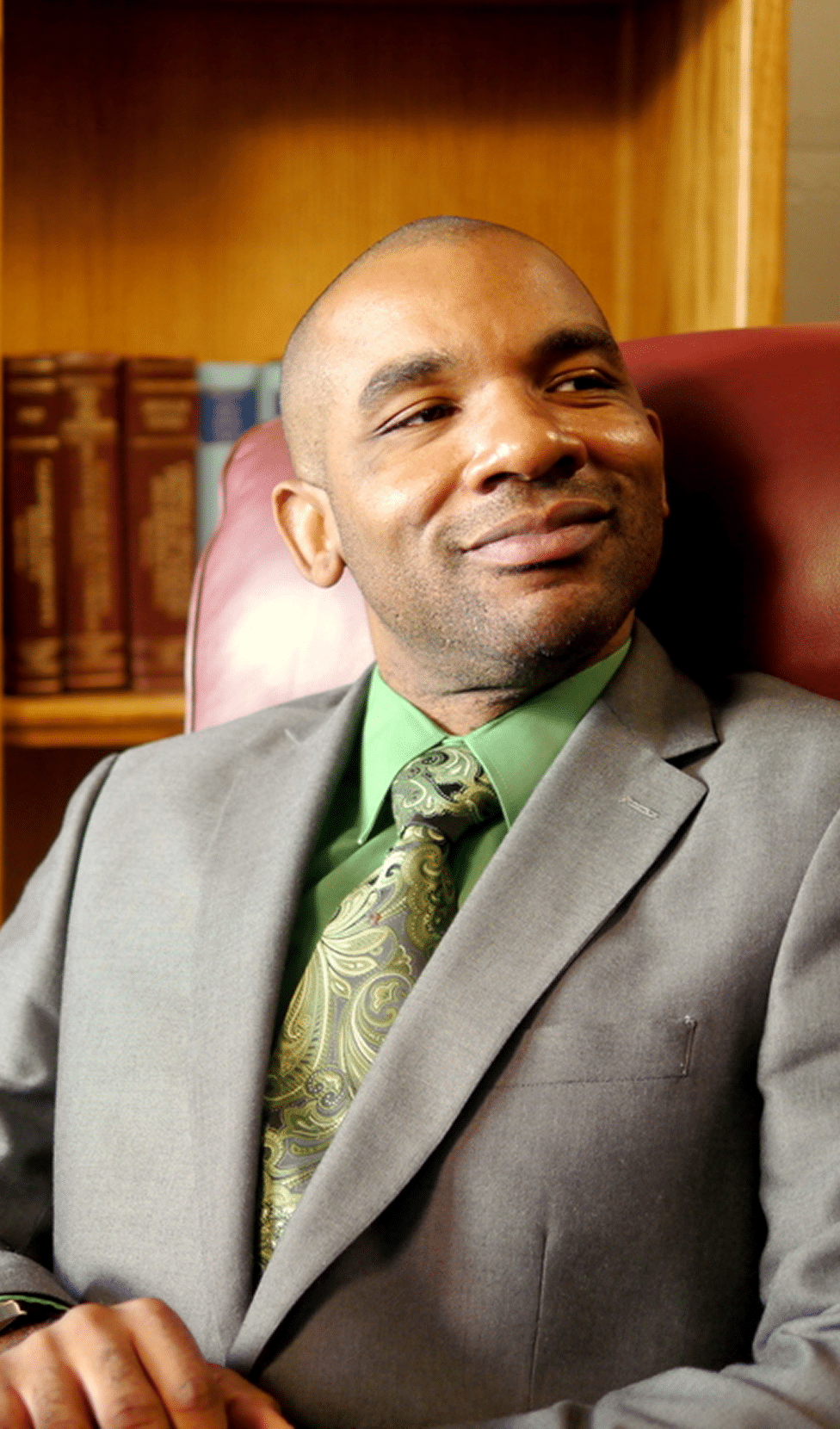 Smiling man in a suit.