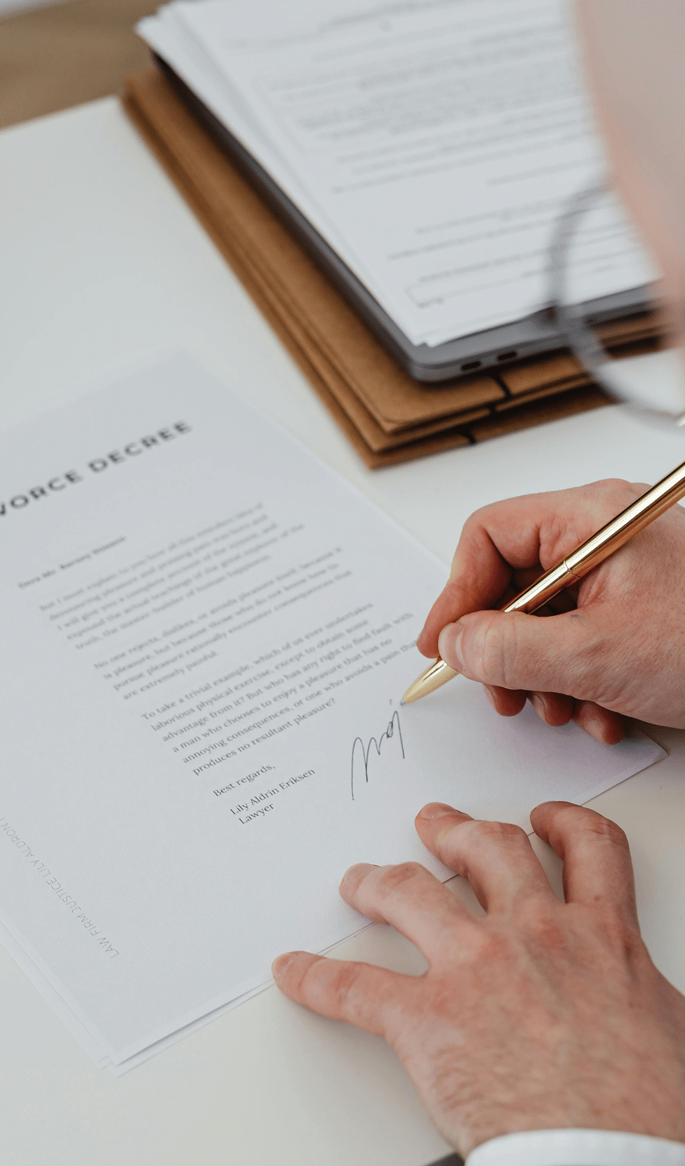 Signing a divorce decree document.
