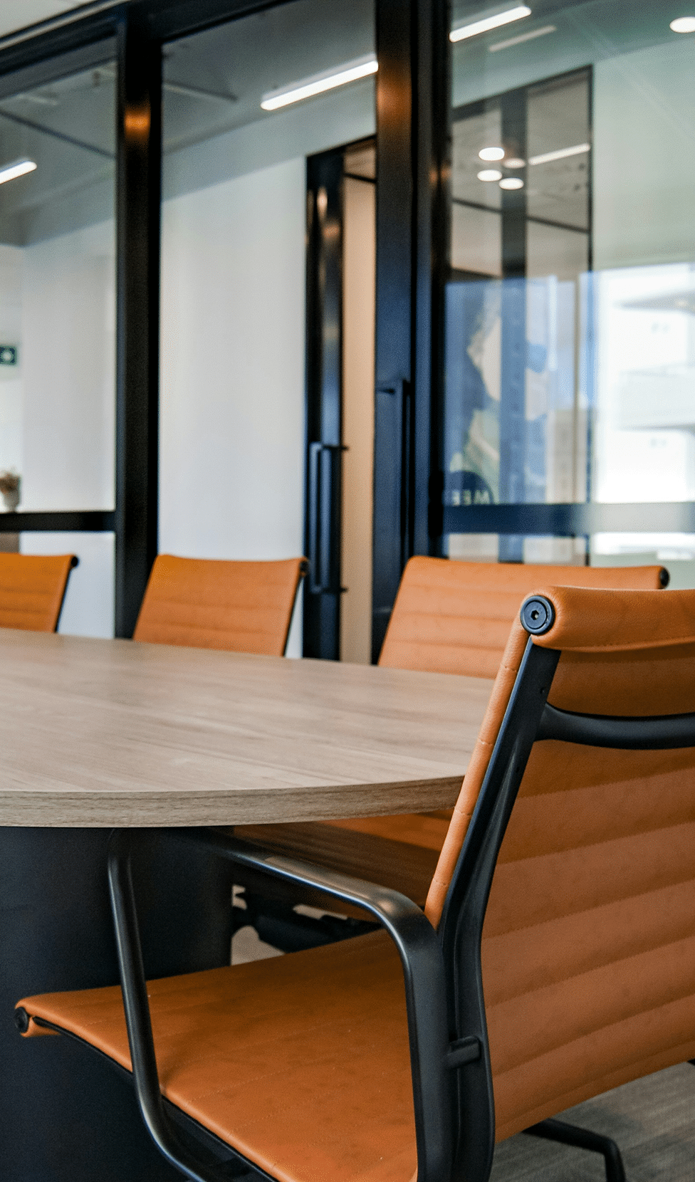Modern conference room with orange chairs
