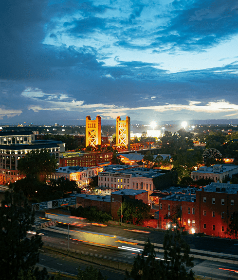 City skyline at dusk with bridges